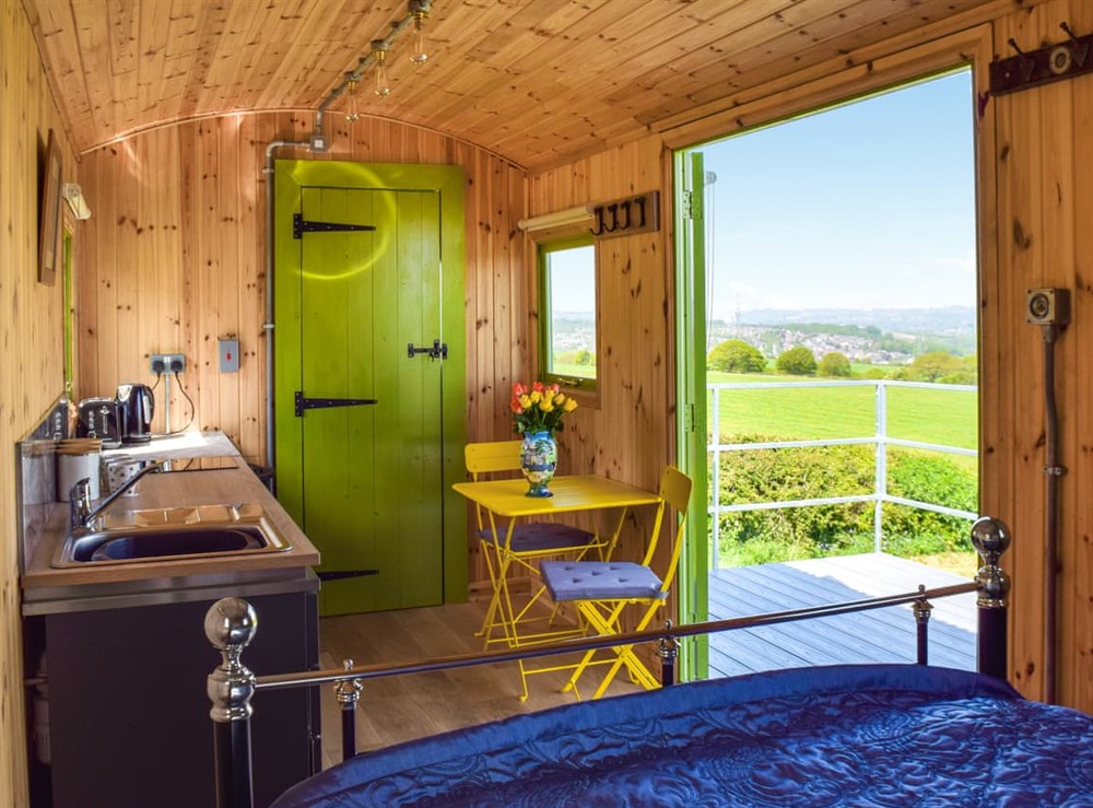 Open plan living space at North Moor Farm Shepherds Hut in Upper Heaton, Huddersfield, West Yorkshire