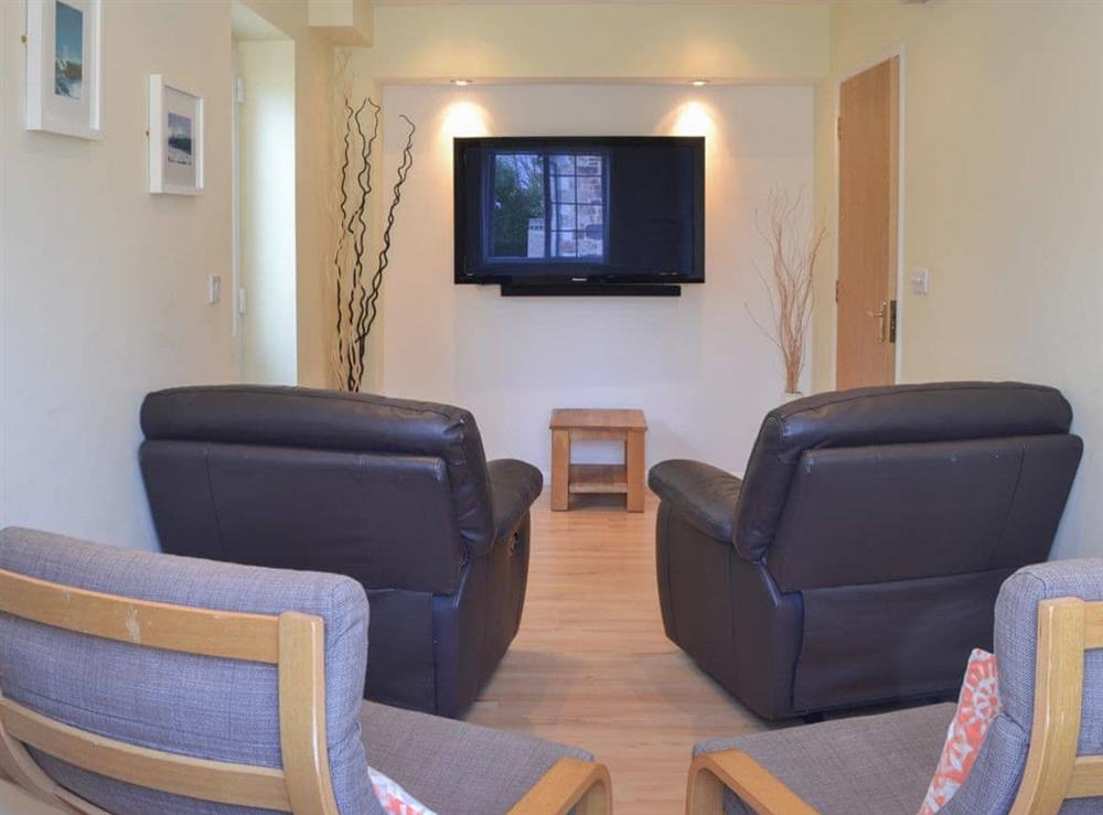 Comfortable and cosy sitting room with large widescreen tv