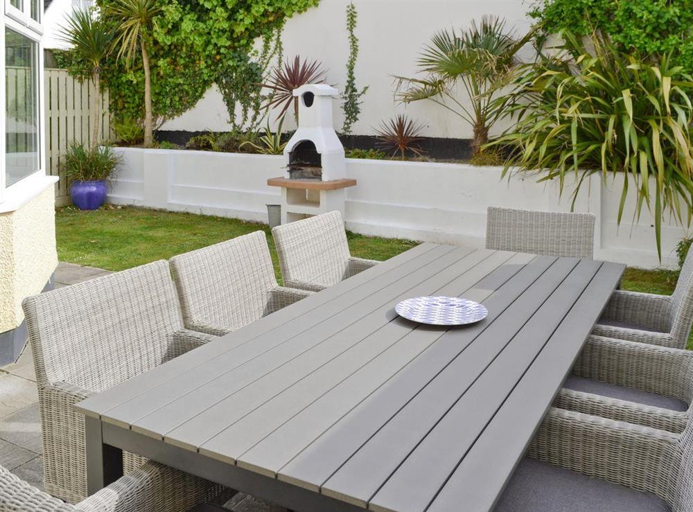 Enclosed garden and patio with built-in BBQ at North Shore in Crantock, N. Cornwall., Great Britain