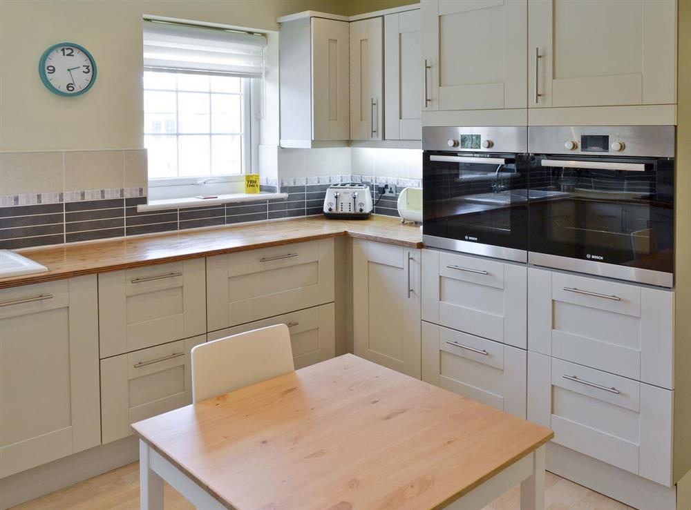 Modern fitted kitchen with built-in appliances at North Shore in Crantock, N. Cornwall., Great Britain