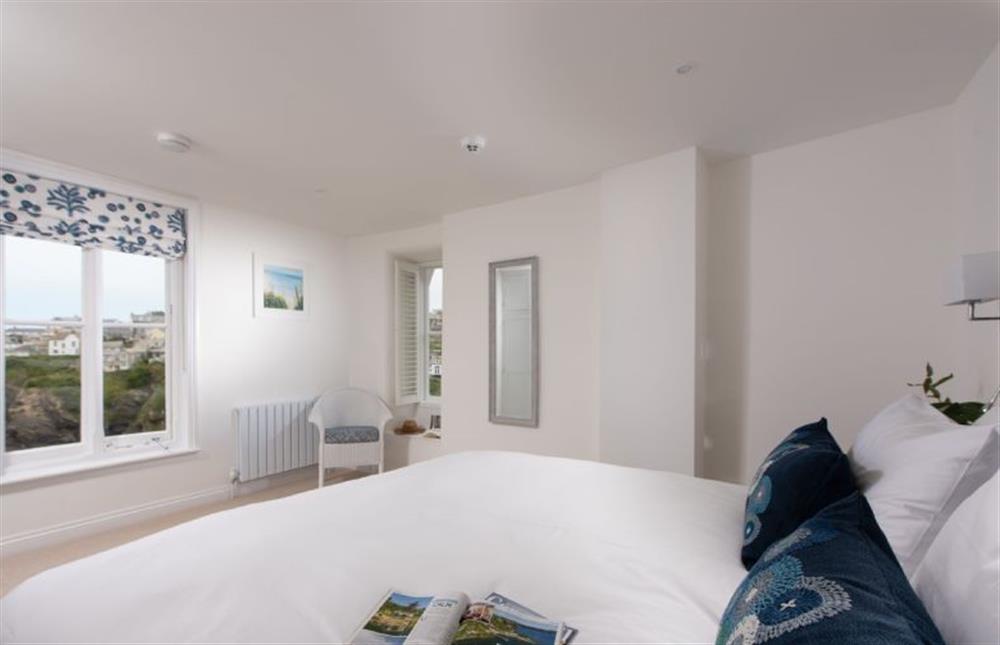 Bedroom three enjoys superb elevated views of the village and harbour at Northcliffe, Port Isaac