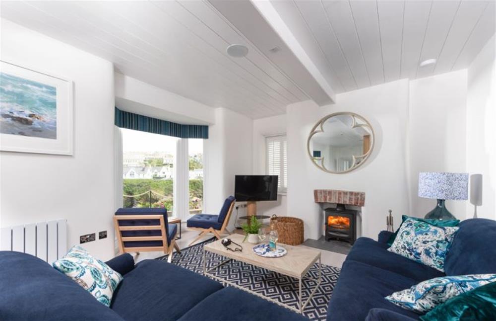 Bright and airy open-plan sitting room with wood burning stove at Northcliffe, Port Isaac