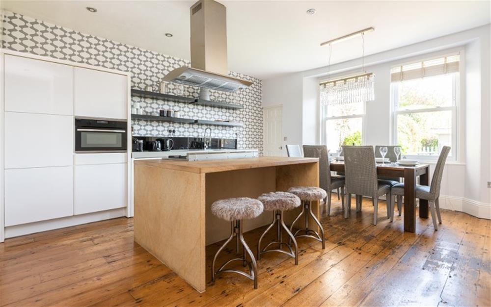 Large fully equipped kitchen with modern appliances, breakfast bar and open plan dining area. at Number 1, Thurlestone Court in Dartmouth