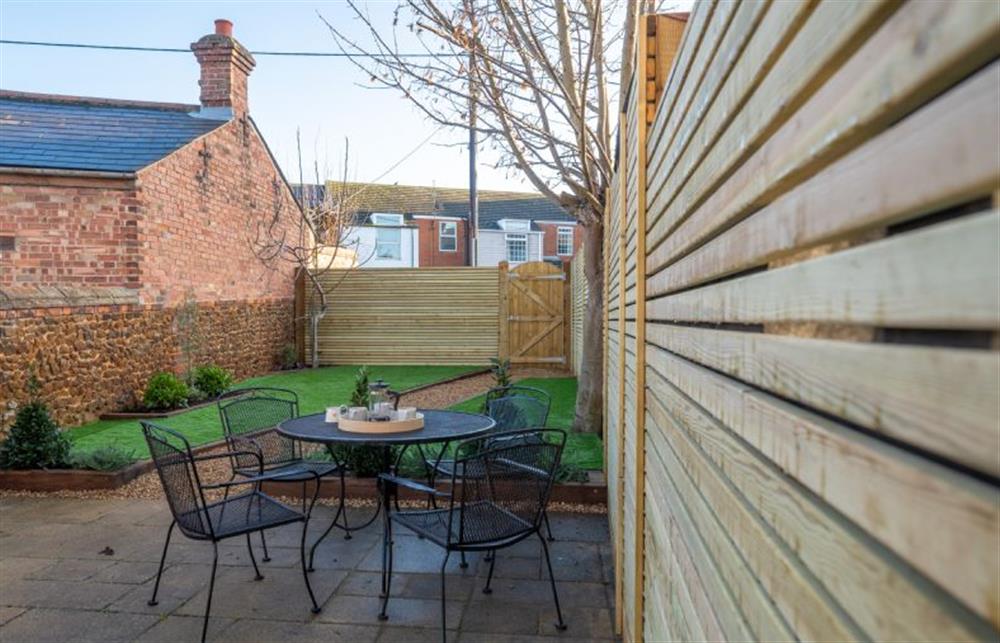 Patio with garden furniture and barbecue at Number 5, Hunstanton