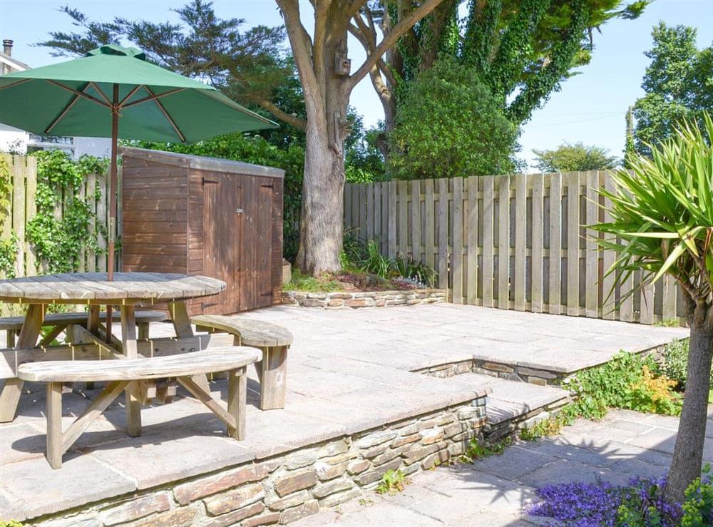 Enclosed courtyard with outdoor furniture at Number Five in St Minver, near Rock, Cornwall
