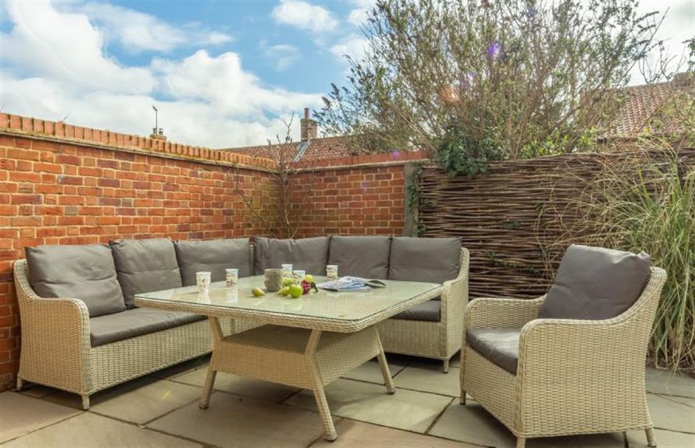 Comfortable seating in the courtyard garden at Number One, Burnham Market near Kings Lynn