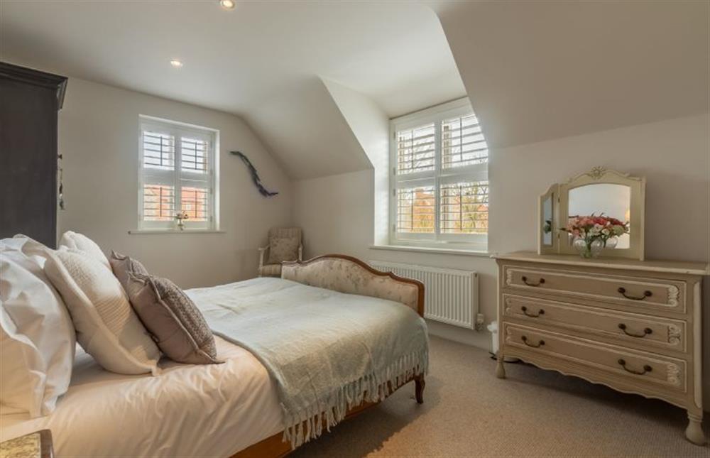 First floor: Bedroom three has double bed at Number One, Burnham Market near Kings Lynn