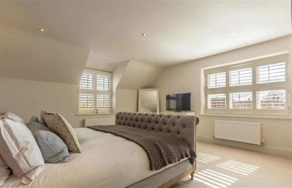 First floor: Duel-aspect master bedroom at Number One, Burnham Market near Kings Lynn