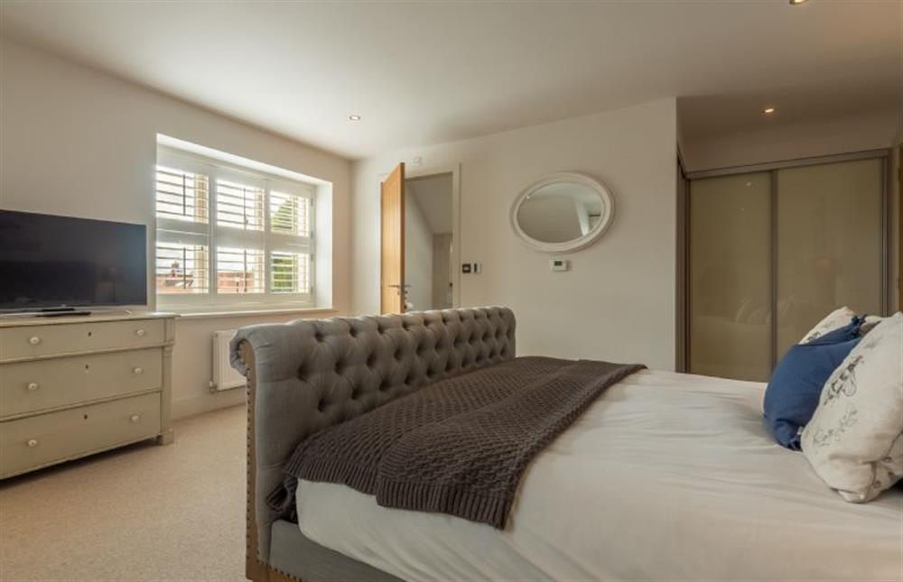 First floor: The master bedroom has en-suite shower room at Number One, Burnham Market near Kings Lynn