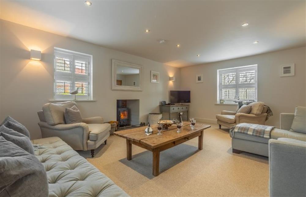 Ground floor: Sitting room with wood burning stove at Number One, Burnham Market near Kings Lynn