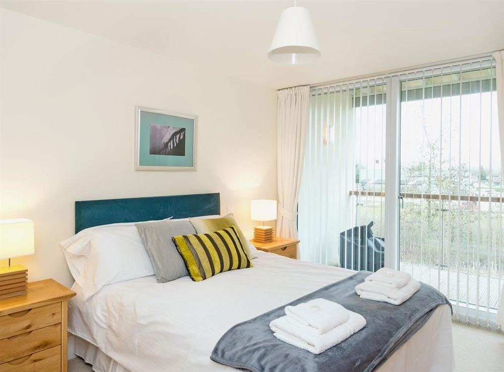 Charming double bedroom offering views from balcony at Nuthatch in Cirencester, Gloucestershire