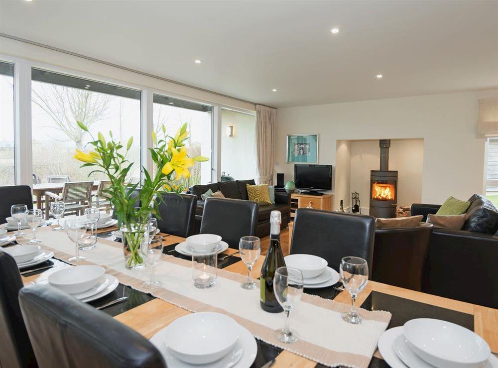 Contemporary living room/dining room with patio doors at Nuthatch in Cirencester, Gloucestershire
