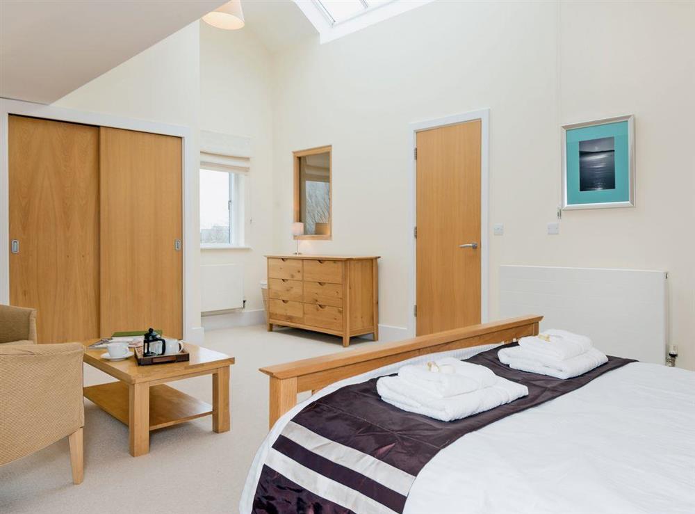 Double bedroom with sitting area at Nuthatch in Cirencester, Gloucestershire