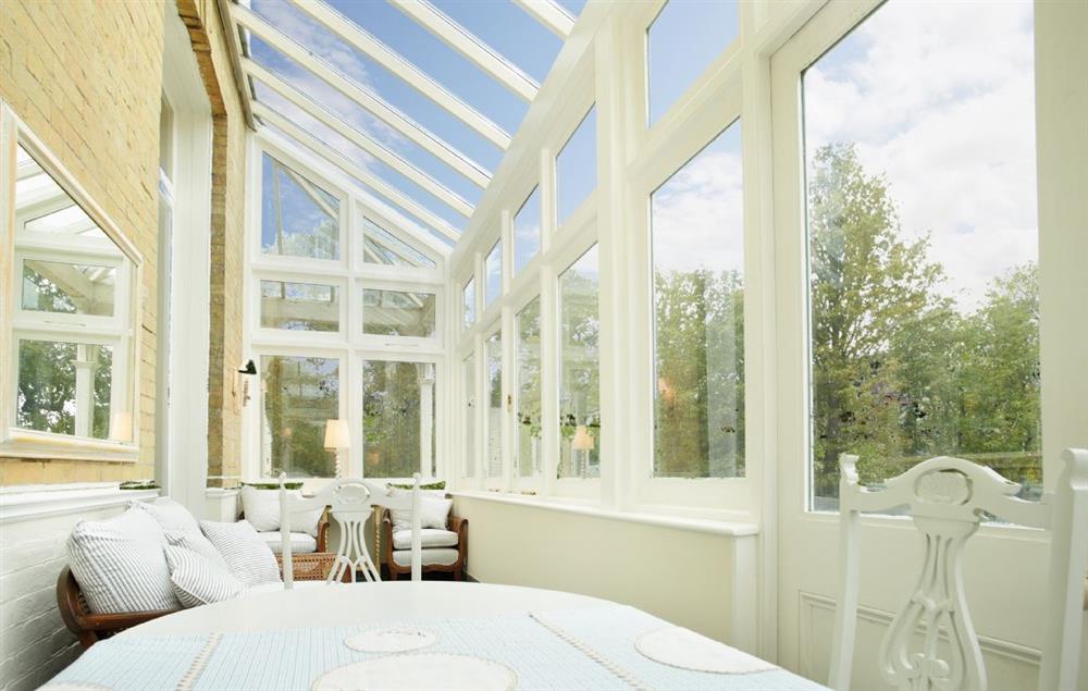 Conservatory adjoining the sitting room overlooking the sea