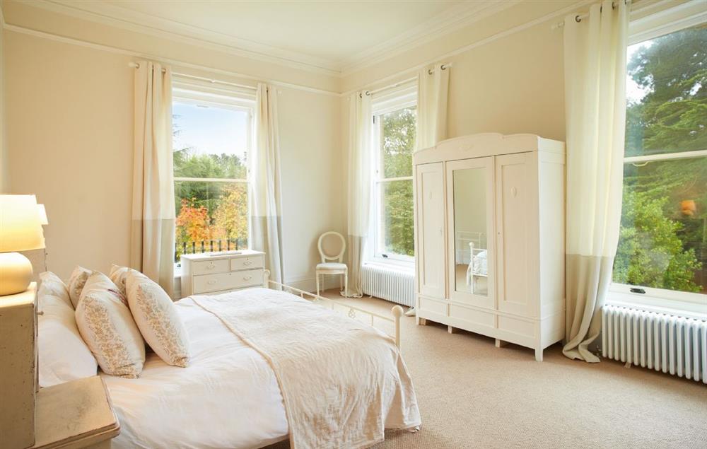 Double bedroom with 6’ bed with adjoining bathroom at Oak Cliff Place, Ryde