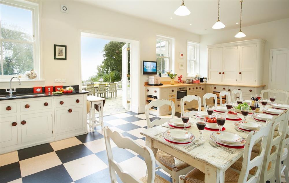 Kitchen with dining. The dining table has an extension and will seat 16 guests at Oak Cliff Place, Ryde