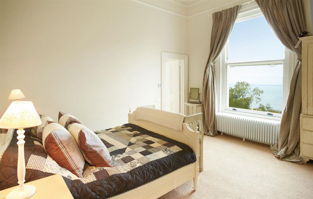 Master bedroom with 5’ bed with en-suite bathroom with separate shower at Oak Cliff Place, Ryde