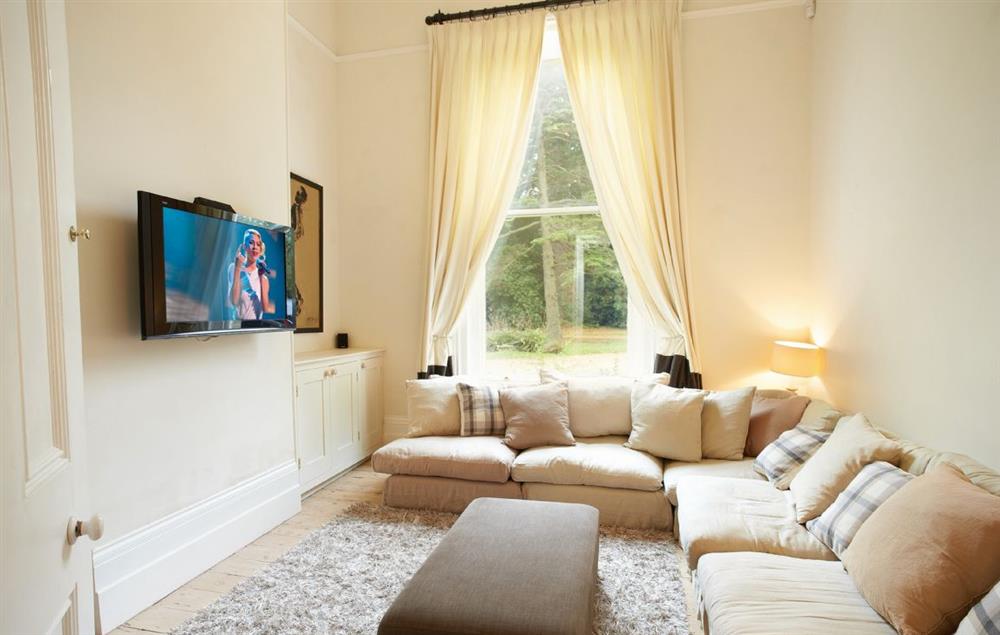 TV snug with wall mounted 42inch television at Oak Cliff Place, Ryde