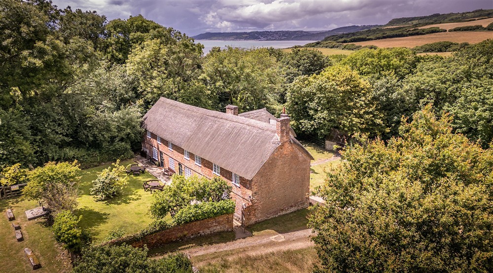 An aerial view of St Gabriels Cottages and their shared garden, Dorset at Oak Cottage in Bridport, Dorset