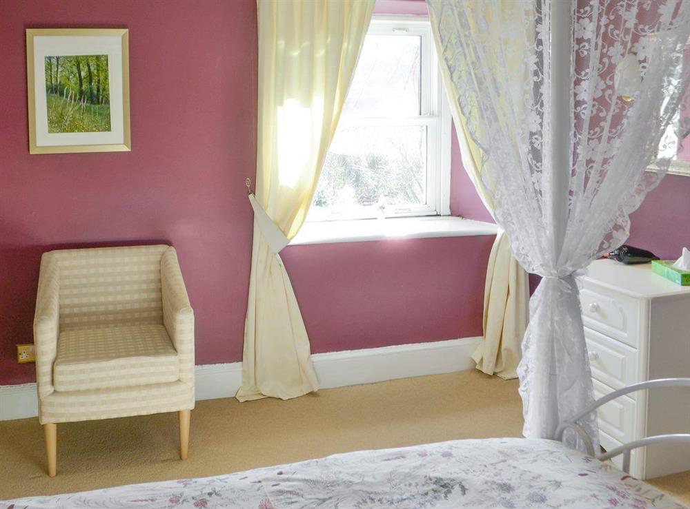 Ample storage and dressing area of four poster bedroom at Oak Cottage in Byrness Village, near Otterburn, Tyne And Wear