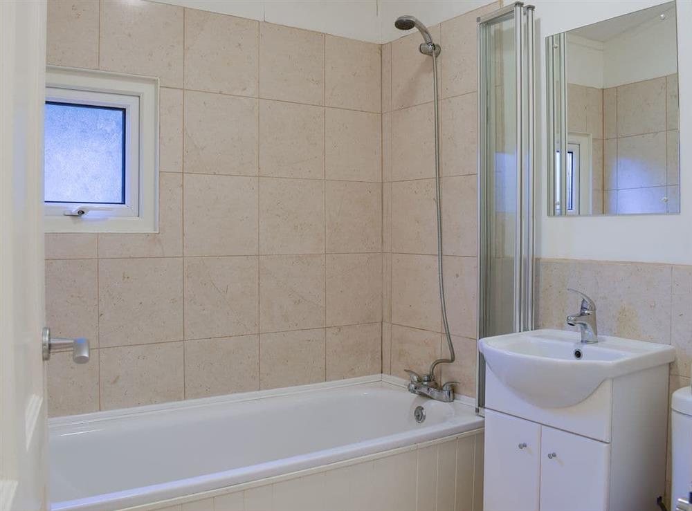 Bathroom with shower over the bath at Oak Haven in Cenarth, near Newcastle Emlyn, Carmarthenshire, Dyfed