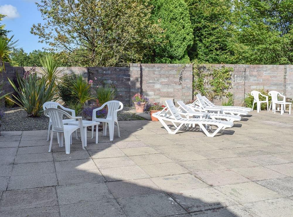 Pleasant patio area next to the shared pool at Oak Haven in Cenarth, near Newcastle Emlyn, Carmarthenshire, Dyfed