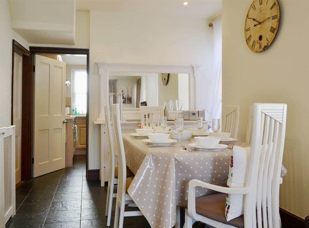A contemporary dining table and chairs give a modern feel to the dining area at Oak Lea in Keswick, Cumbria