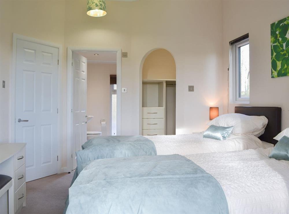 Attractive bedroom with en-suite bathroom at Oak Lodge in Clatworthy, near Williton, Somerset
