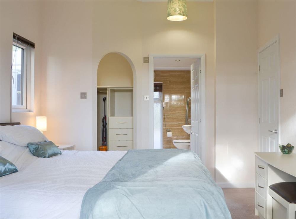 Charming bedroom with en-suite shower room at Oak Lodge in Clatworthy, near Williton, Somerset