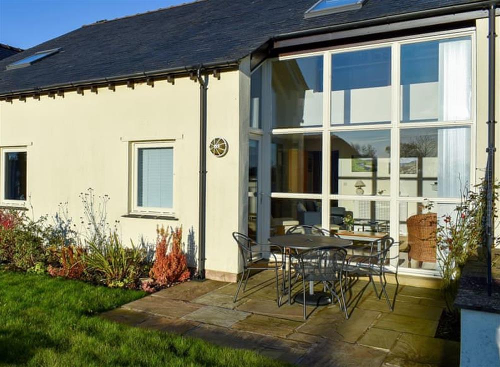 Garden with patio and furniture at Oak Meadow in Kirkby Lonsdale, Lancashire