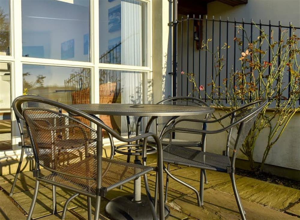 Tranquil patio with garden furniture at Oak Meadow in Kirkby Lonsdale, Lancashire