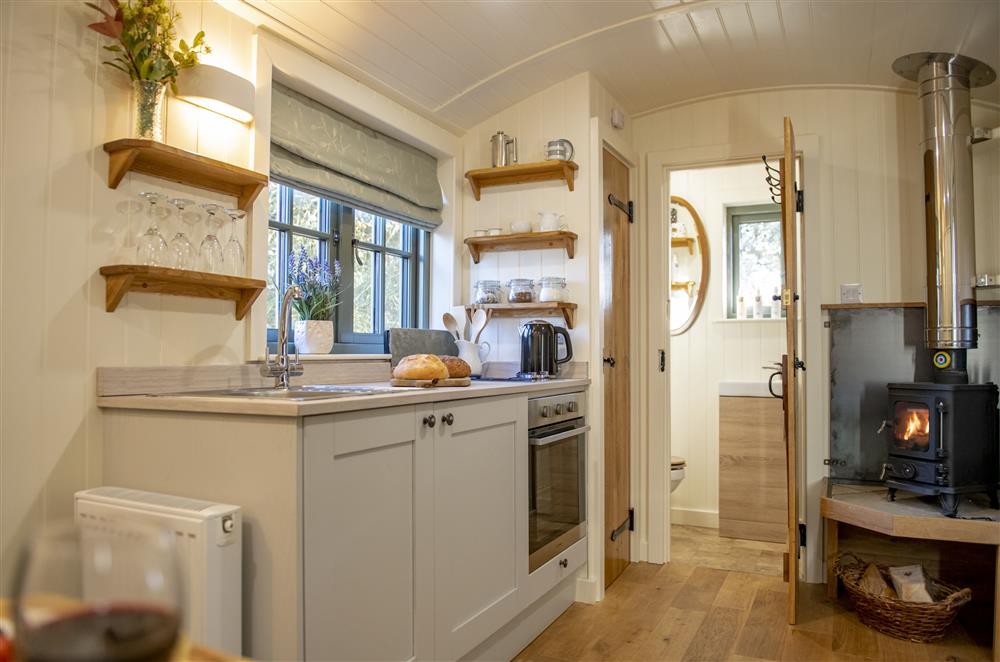 The kitchen area has a two ring gas hob, electric oven and fridge  at Oak Retreat, Blencowe, near Greystoke