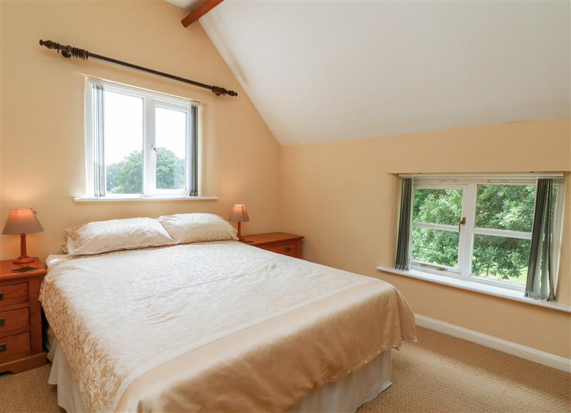 A bedroom in Oak Tree Cottage at Oak Tree Cottage, Broadwoodkelly near Winkleigh