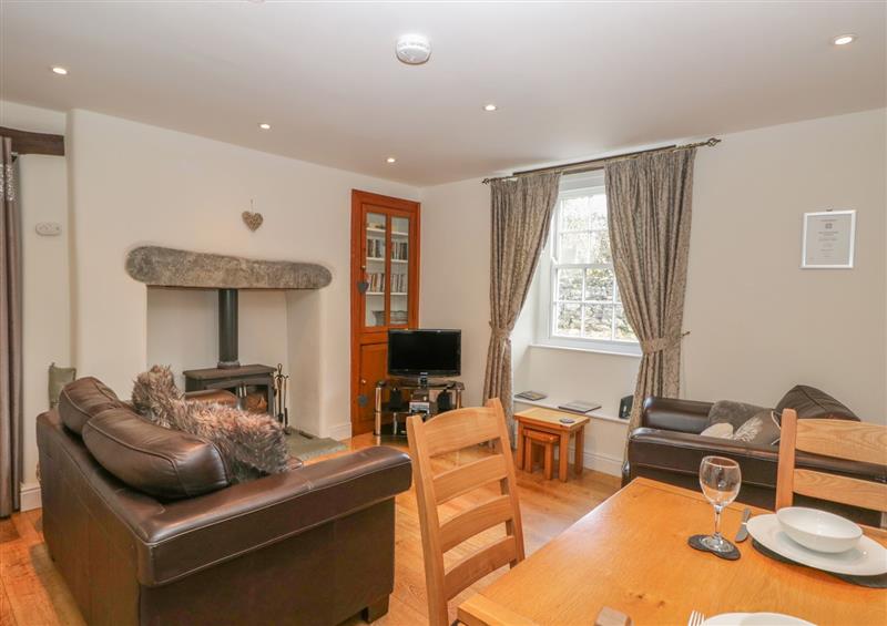Relax in the living area at Oak Tree Cottage, Coniston