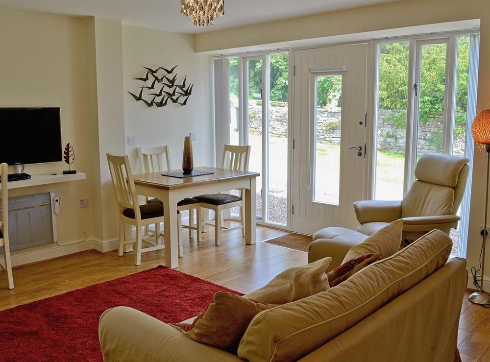 Open plan living/dining room/kitchen at Oak Tree Cottage, 