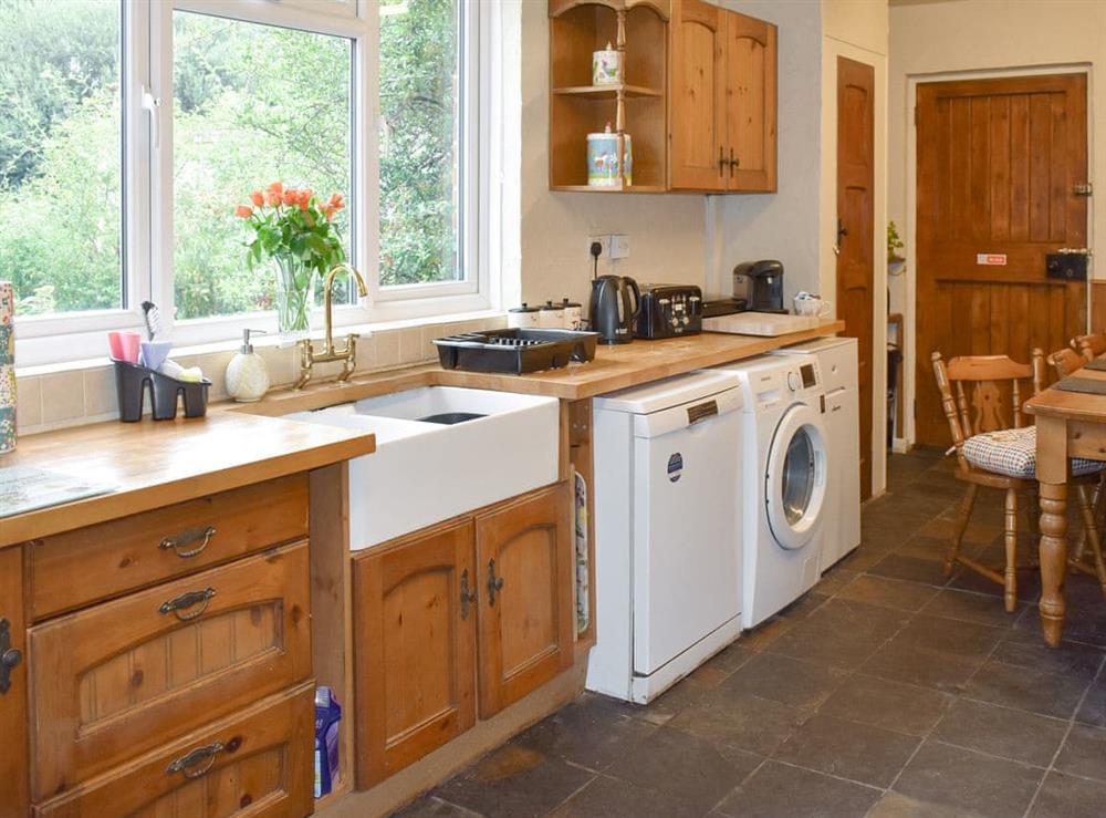 Characterful kitchen with dining area at Oakdene Lodge in Wimborne, Dorset