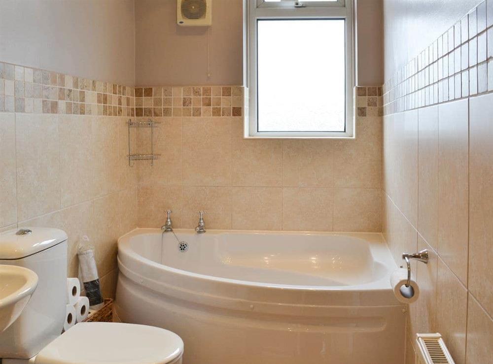Bathroom with corner bath at Oaklands View in Scarborough, North Yorkshire