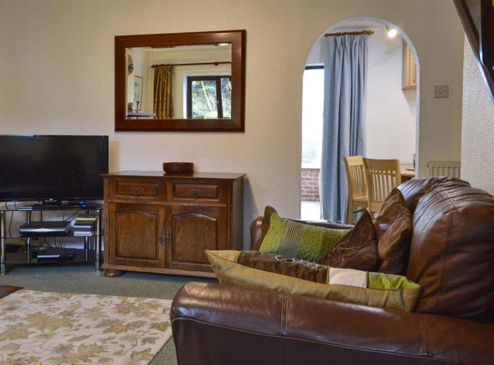 Comfortable living room with open fire at Oakleigh Cottage in Rowen, Nr Conwy, Gwynedd., Great Britain