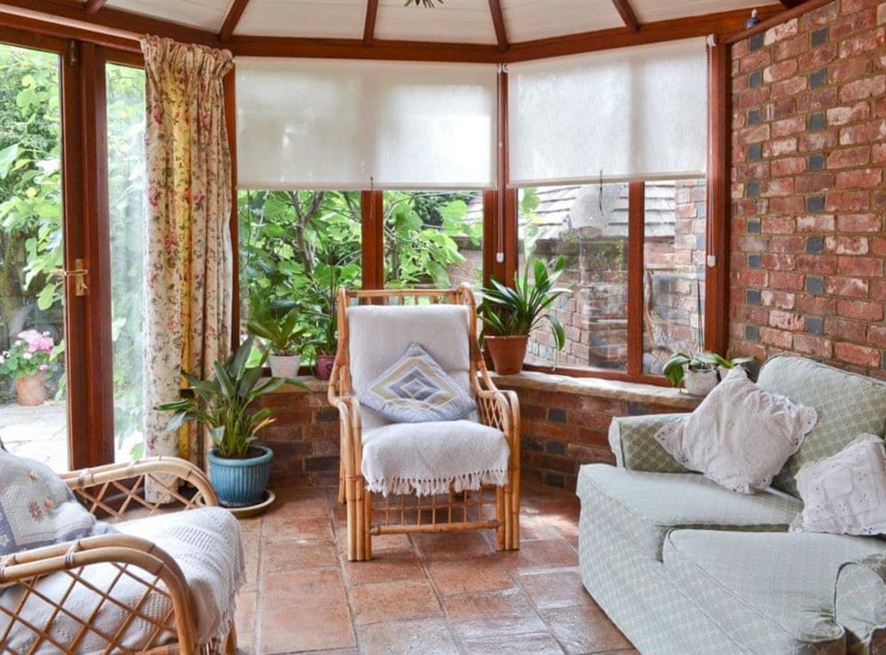 Sun room at Oast Cottage in Herstmonceux, near Hailsham, East Sussex