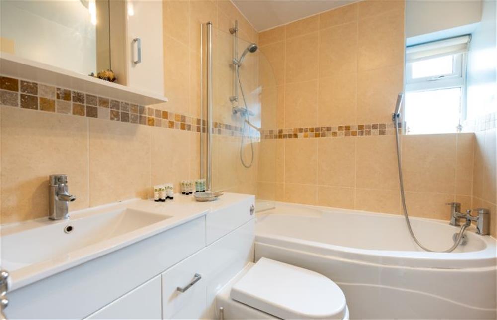 Ground floor: Bathroom with bath and shower over at Ocean Drive, Heacham near Kings Lynn