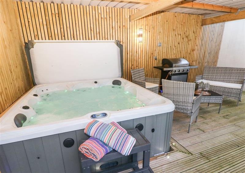 Relax in the hot tub at Ocean House, Hasguard Cross near Broad Haven