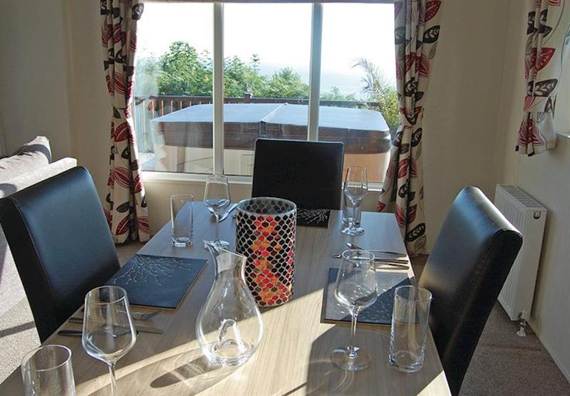 Dining area, with views out to the hot tub, at Sunrise at Ocean Lodges in Corton, Lowestoft