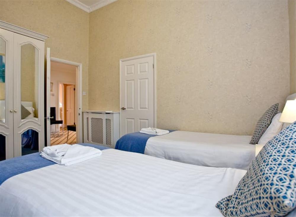 Twin bedroom (photo 2) at Ocean Shangri-La, Bay Fort Mansions in Torquay, South Devon