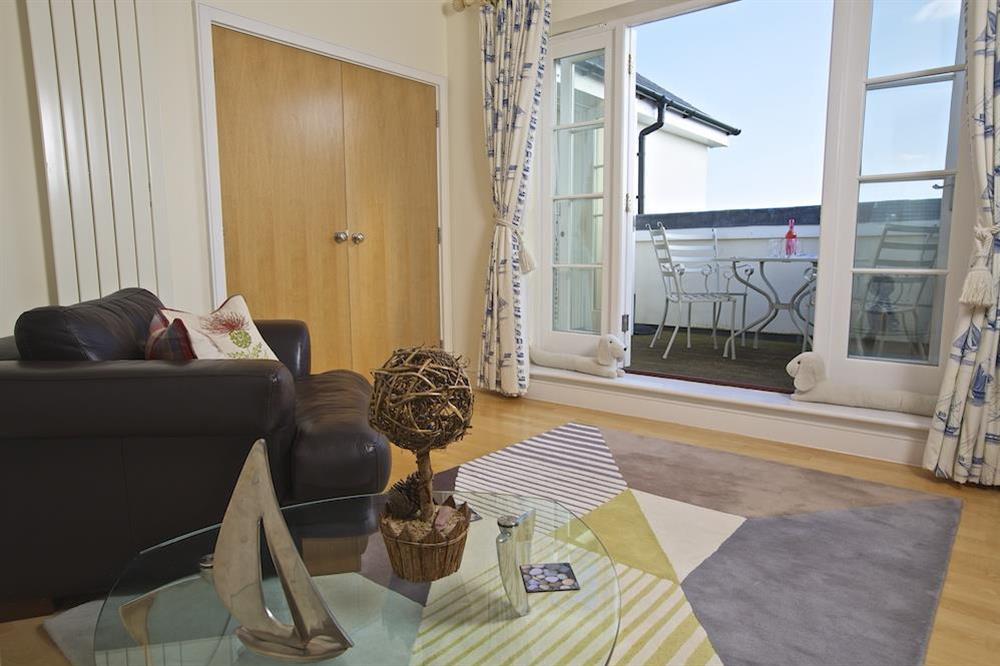 Lounge with doors leading to the rooftop terrace at Oceanview Apartment in Thurlestone, Nr Kingsbridge