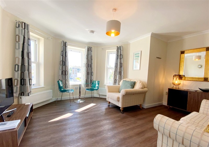 Relax in the living area at Ockendon House Apartment A, Torquay