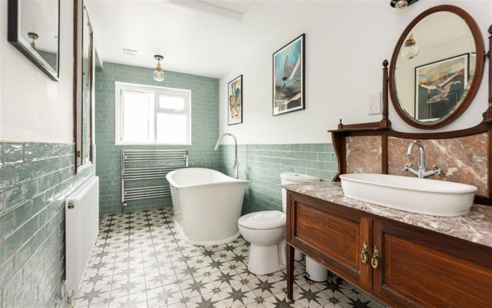 The stunning bathroom, adjacent to master bedroom at Old Barn Cottage in Newton Ferrers
