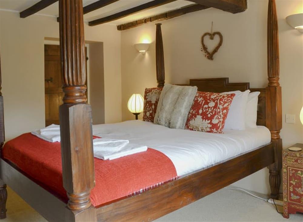 Relaxing four poster bedroom at Old Beams in Waterhouses, near Leek, Staffordshire