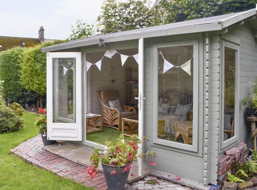 Fully-furnished summerhouse within garden at Old Brewery Cottage in Melkridge, Northumberland