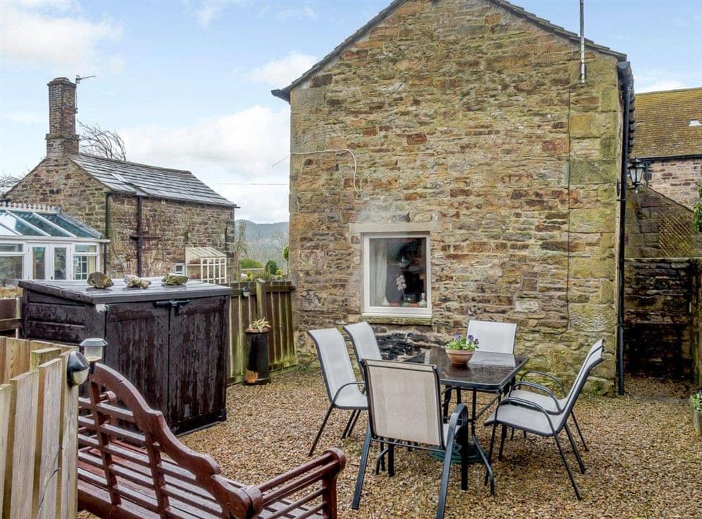 Outdoor eating area at Old Brewery Cottage in Melkridge, Northumberland