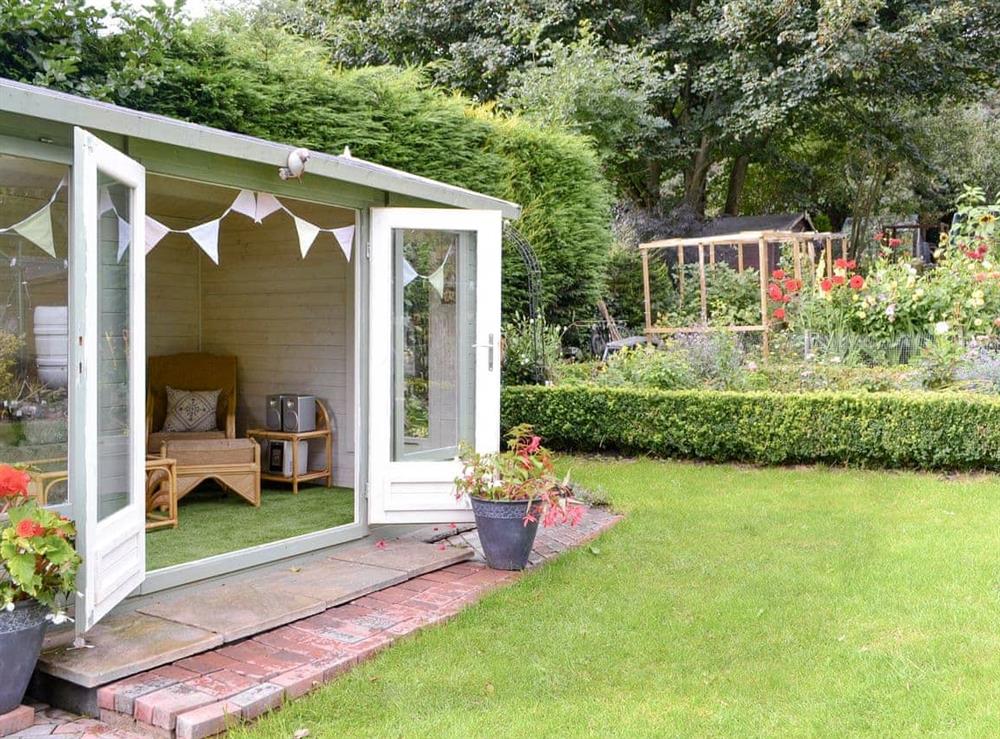 Quirky summerhouse within garden at Old Brewery Cottage in Melkridge, Northumberland